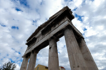 Roman agora gate towering above with majestic columns in athens, greece