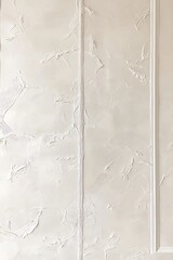Elegant White Stucco Wall with Decorative Trim Detail, Soft Lighting