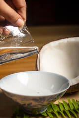 woman pouring milk into bowl