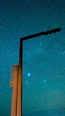 Wild Atlantic Way sign on Sky Road under a starry night sky, Connemara, Ireland