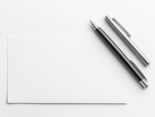 Naklejka premium Minimalistic workspace with blank paper and pens for creative writing or planning