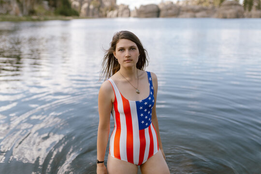 Woman in patriotic swimsuit standing in Sylvan Lake, SD