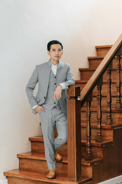 young man standing on stairs
