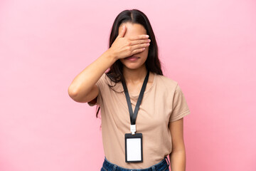 Young Colombian woman with a motorcycle helmet isolated on white background covering eyes by hands....