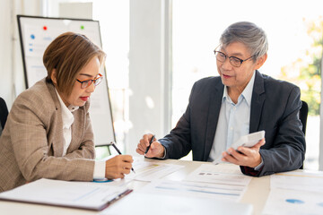 Co working conference, Business team meeting present, investor colleagues discussing new plan financial graph data on office table with calculator, Finance, accounting, investment.
