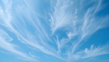 Obraz premium White feathers floating in a bright blue sky with fluffy clouds