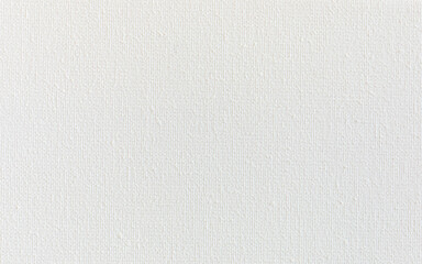 Primed white cotton canvas background texture. Gesso-coated (acrylic base) canvas.