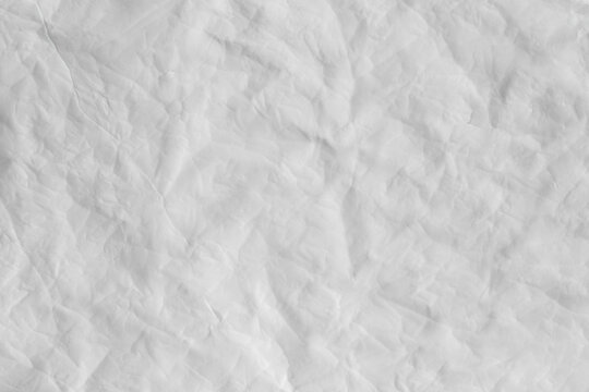 Crumpled wet tracing paper as a background texture.