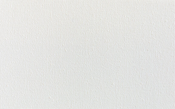 Primed white cotton canvas background texture. Gesso-coated (acrylic base) canvas.