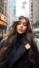 Fototapeta premium Woman in a black coat with money falling around her in snowy city street.