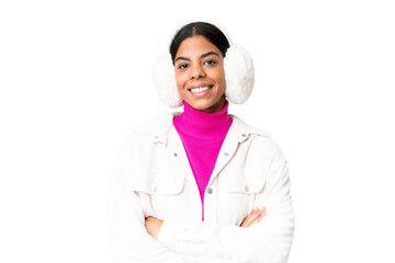 Young African American woman wearing winter muffs over isolated chroma key background keeping the...
