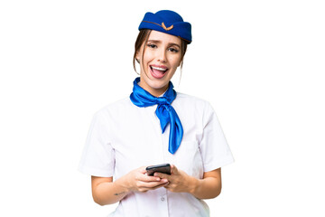 Airplane stewardess over isolated chroma key background surprised and sending a message
