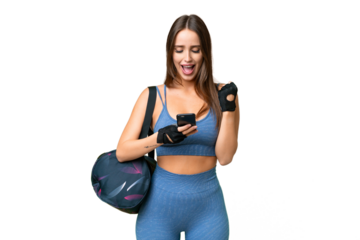 Young sport woman with sport bag over isolated chroma key background surprised and sending a message