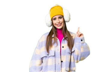 Young woman wearing winter muffs over isolated chroma key background showing and lifting a finger in sign of the best