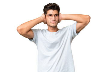 Young caucasian handsome man over isolated background frustrated and covering ears