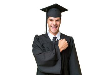 Young university graduate caucasian man over isolated background celebrating a victory