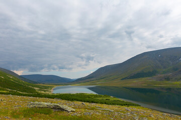Summer day landscape with mountains and lake in the tundra, Yamal, Russia