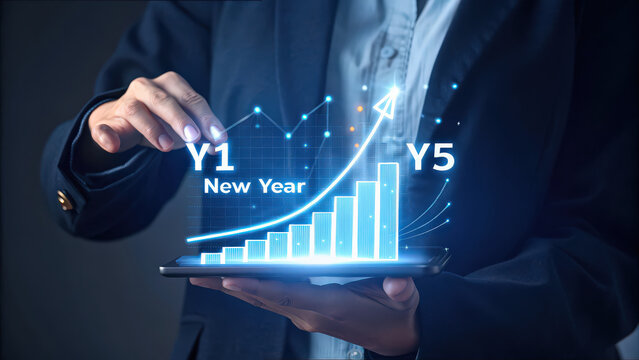person in suit holds tablet displaying futuristic business graph with rising trend, labeled Y1 and Y5, symbolizing growth and progress over time