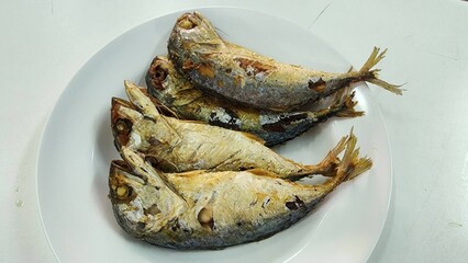 Freshly Cooked Fish on a White Plate Displayed for Presentation