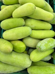 Pile of summer squash for sale at the fresh farmers market. 
