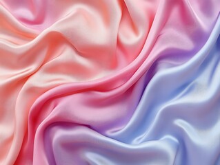 Obraz premium Pastel pink, orange, and purple silk fabric with soft waves and folds.
