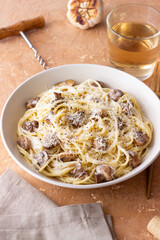 Spaghetti pasta in creamy sauce with mushrooms and cheese. Vegetarian food. Italian cuisine.
