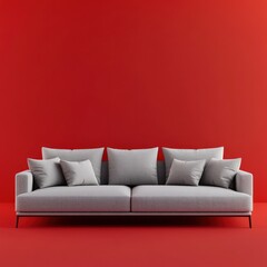 Modern gray sofa against a red wall