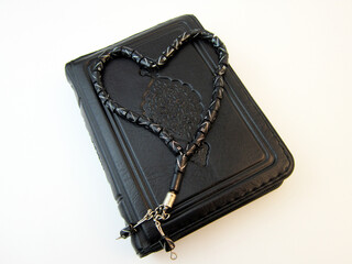 The Holy Quran and prayer beads. Arabic word translation 