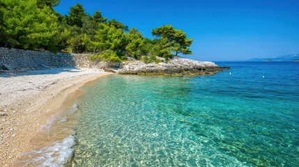 Secluded cove with pristine beach and crystal-clear turquoise water.