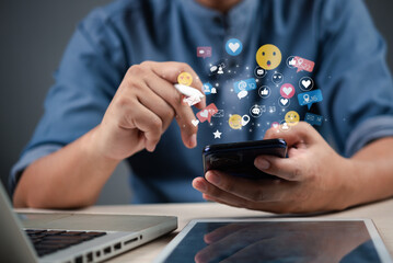 businessman using a smartphone with social media icons floating around, representing digital marketing and online communication.