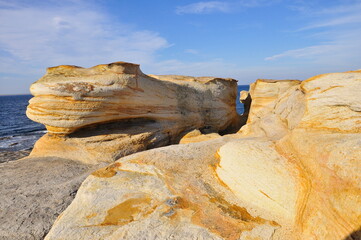 The shore of red stones, patterns on the rocks.