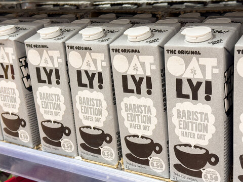 Oat milk cartons on shelf &ndash; barista edition oatly in grocery store display