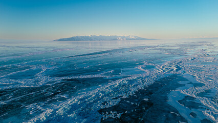 A mesmerizing aerial view of Lake Baikal's icy surface, showcasing intricate patterns and textures...