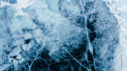 A mesmerizing aerial view of Lake Baikal's icy surface, showcasing intricate patterns and textures of the frozen landscape.