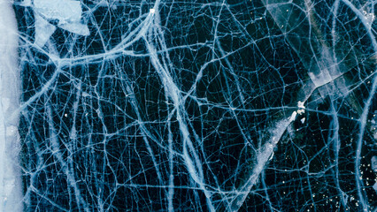 A mesmerizing aerial view of Lake Baikal's icy surface, showcasing intricate patterns and textures of the frozen landscape.