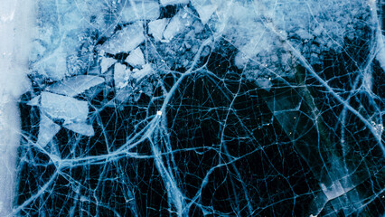 A mesmerizing aerial view of Lake Baikal's icy surface, showcasing intricate patterns and textures of the frozen landscape.