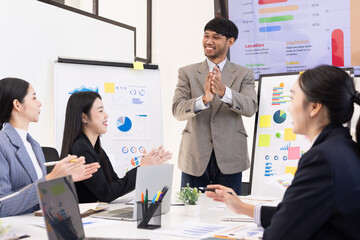 Group of business people working together with dashboard analysis and data management a meeting table in an office.