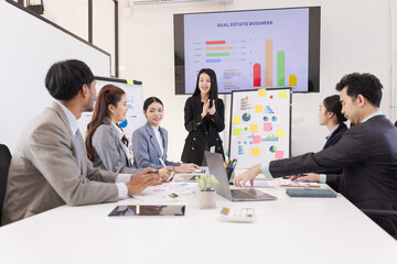Group of business people working together with dashboard analysis and data management a meeting table in an office.