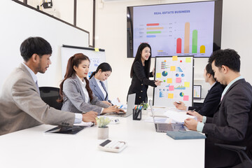 Group of business people working together with dashboard analysis and data management a meeting table in office.