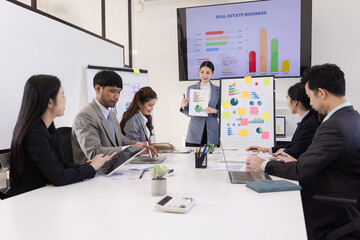 Group of business people working together with dashboard analysis and data management a meeting...