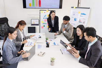 Group of business people working together with dashboard analysis and data management a meeting table in office.