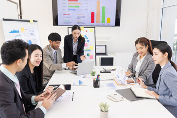 Group of business people working together with dashboard analysis and data management a meeting table in office.