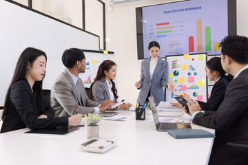 Group of business people working together with dashboard analysis and data management a meeting table in office.