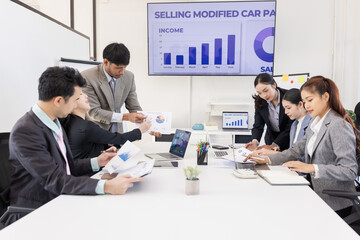 Group of business people working together with dashboard analysis and data management a meeting table in office.