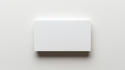 Blank white card on a flat surface, symbolizing simplicity and clarity in design.