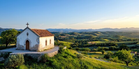 Fototapeta premium A small chapel perched on a hillside, with panoramic views of the surrounding countryside