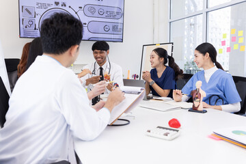 Group of Asian doctor working together and brainstorm at the clinic, Healthcare and medical meeting concept.