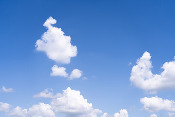 Sky background with white clouds on a bright day