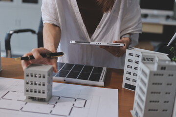 Discussion among businesspeople on the latest developments in solar cell panel technology and Solar...
