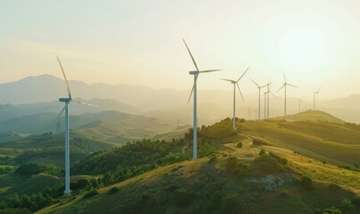 Naklejka premium A group of wind turbines are on a hillside, with the sun shining on them